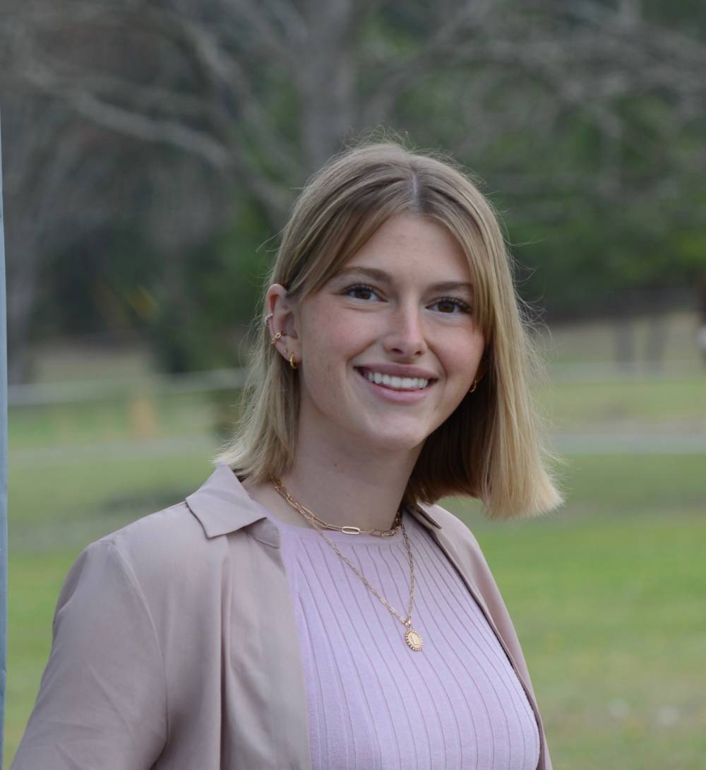 Image 1 of 2 Female student outdoors smiling for a picture